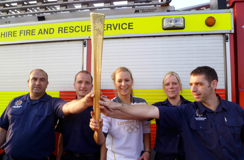 Suzanne shares an Olympic moment with her firefighter mates